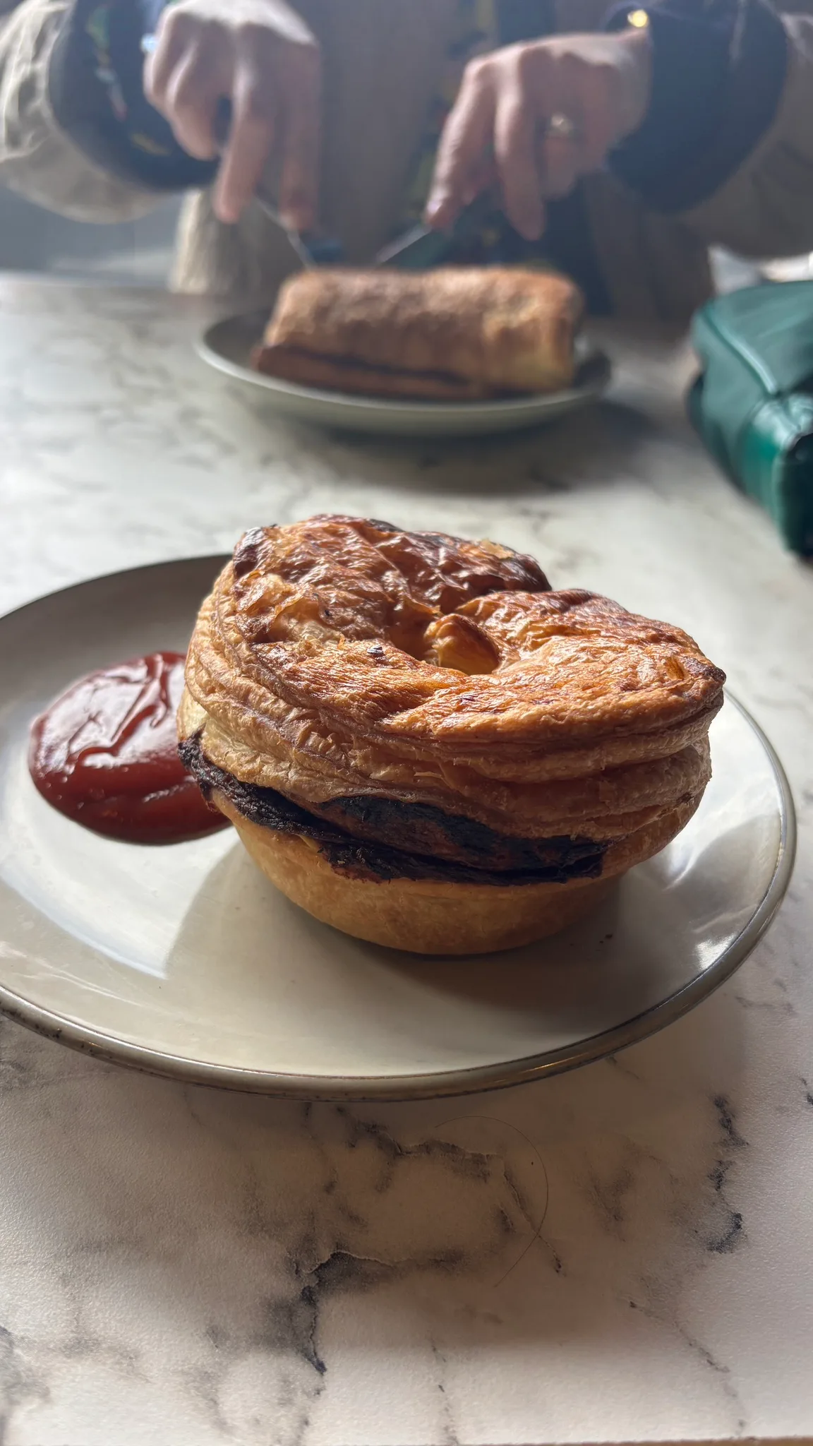 Kristof is 🥐 eating at Ocab Bakery with Nada.