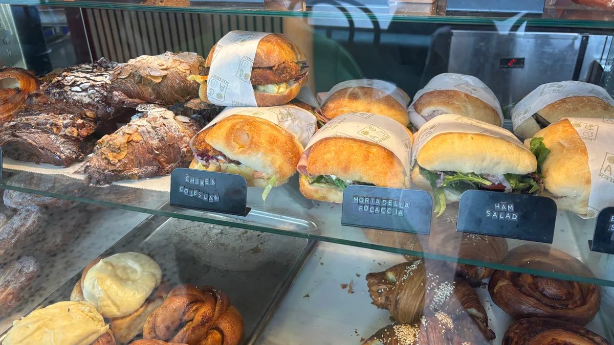 Kristof is 🥐 eating at Ocab Bakery with Raphael.