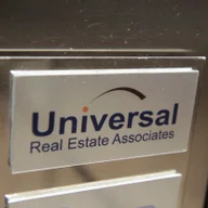 Universal Real Estate Associates logo