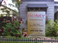 Honey Wax & Tan logo
