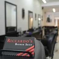 Riccardo's Barber Shop logo