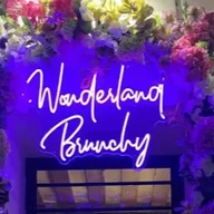 Wonderland Brunchy Louvre/restaurant brunch logo