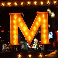 Menotomy Grill and Tavern logo