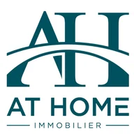 At Home Real Estate logo