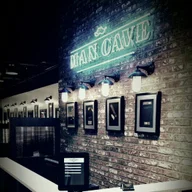 Man Cave Barber Shop logo