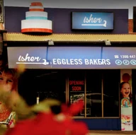 Isher Eggless Bakers logo