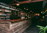 Mr West Bar and Bottle Shop logo