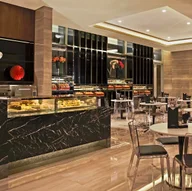 Tuxedo Cafe and Patisserie logo