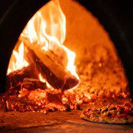Smoko Woodfired Pizza logo