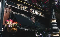 Guinea Grill logo