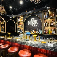 At Nine Restaurant and Bar logo