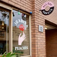 Juanita Peaches logo