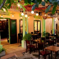 Nom Cafe and Bistro logo