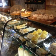 Lucchini Cakes and Cafe logo
