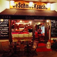 Frühstücks Cafe GeScHmacKsachE logo